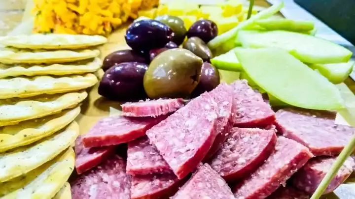 Close-up of charcuterie and snacks board