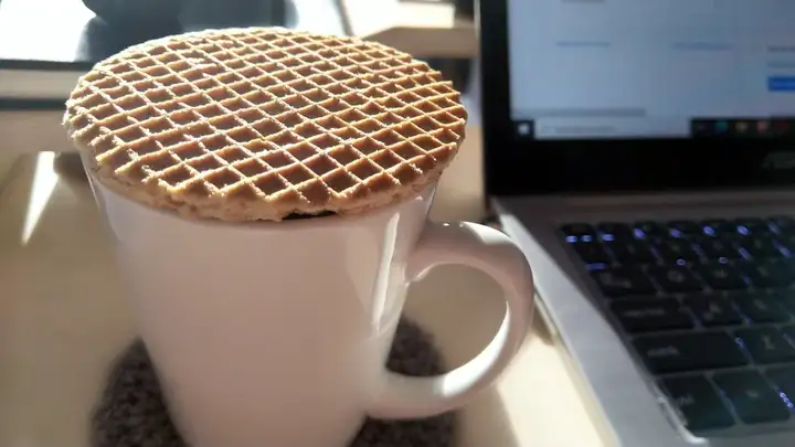 Stroopwafel cookie on top of a cup of coffee
