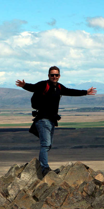 TravelGeek Marty standing on top of a hill/mountain