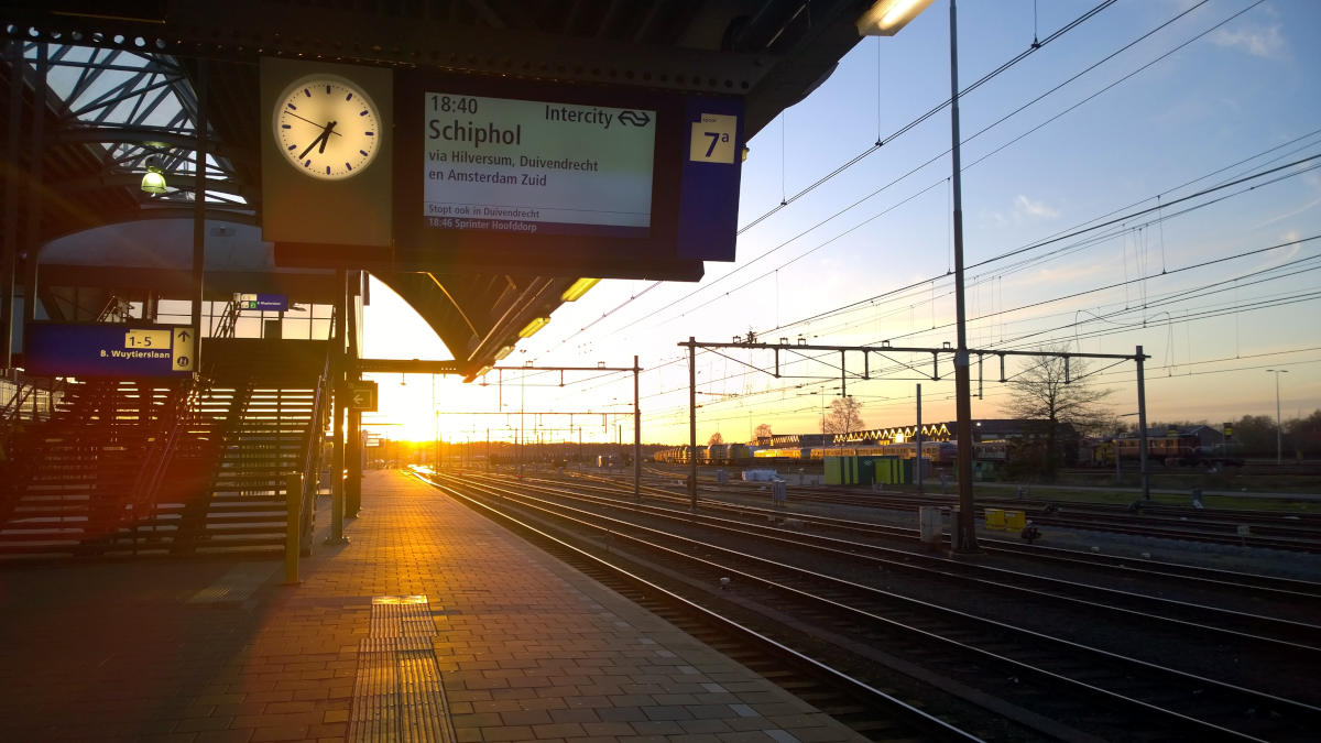 Sunsetting over bunch of railroad tracks. View from the platform while waiting for the train