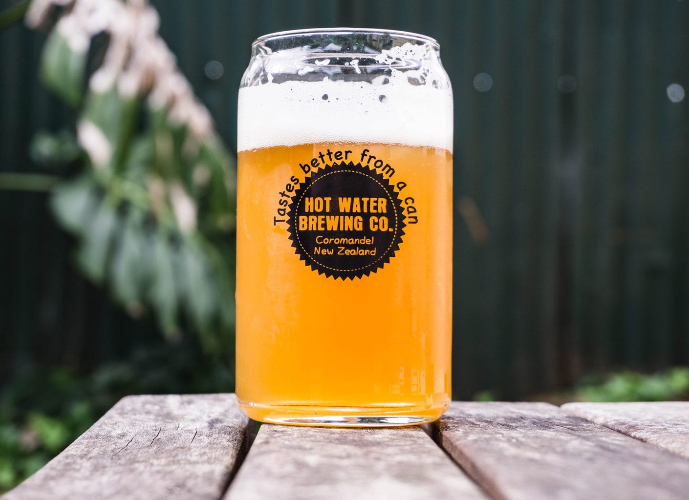 Beer glass shaped like a can and the text: tastes better from a can