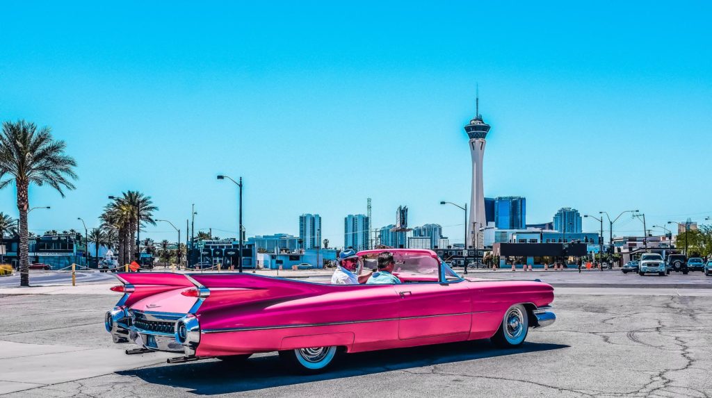 Pink Cadillac skyline with Stratosphere Hotel