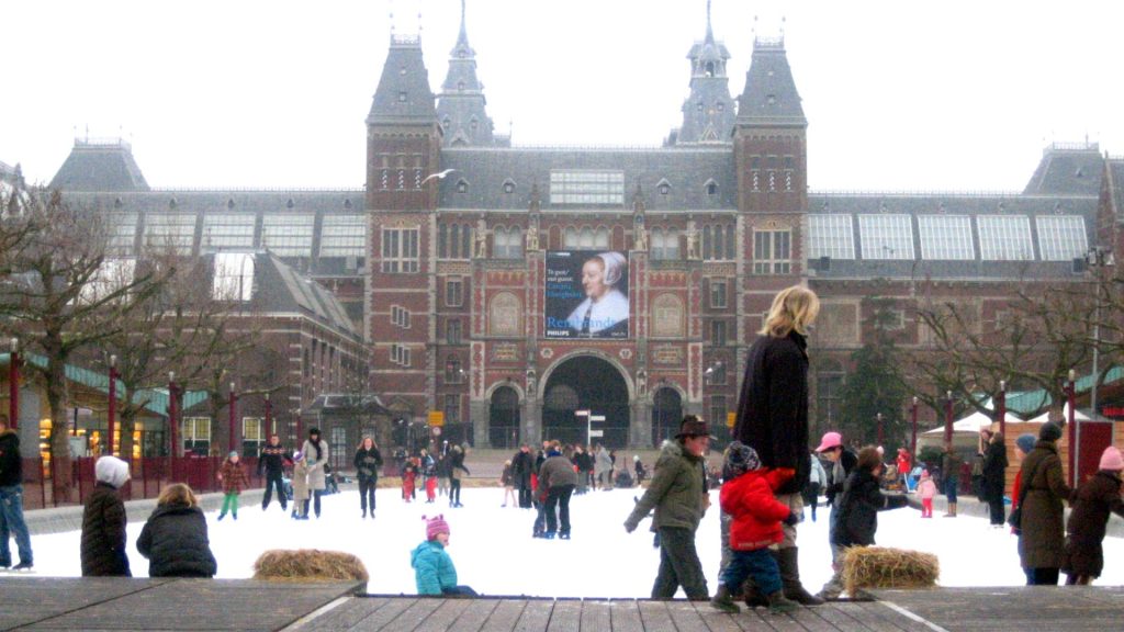 Rijksmuseum in winter - people iceskating in the foreground